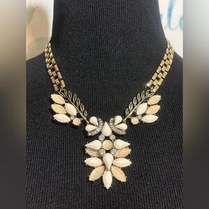 Cream And Clear Crystals On Gold Tone Background